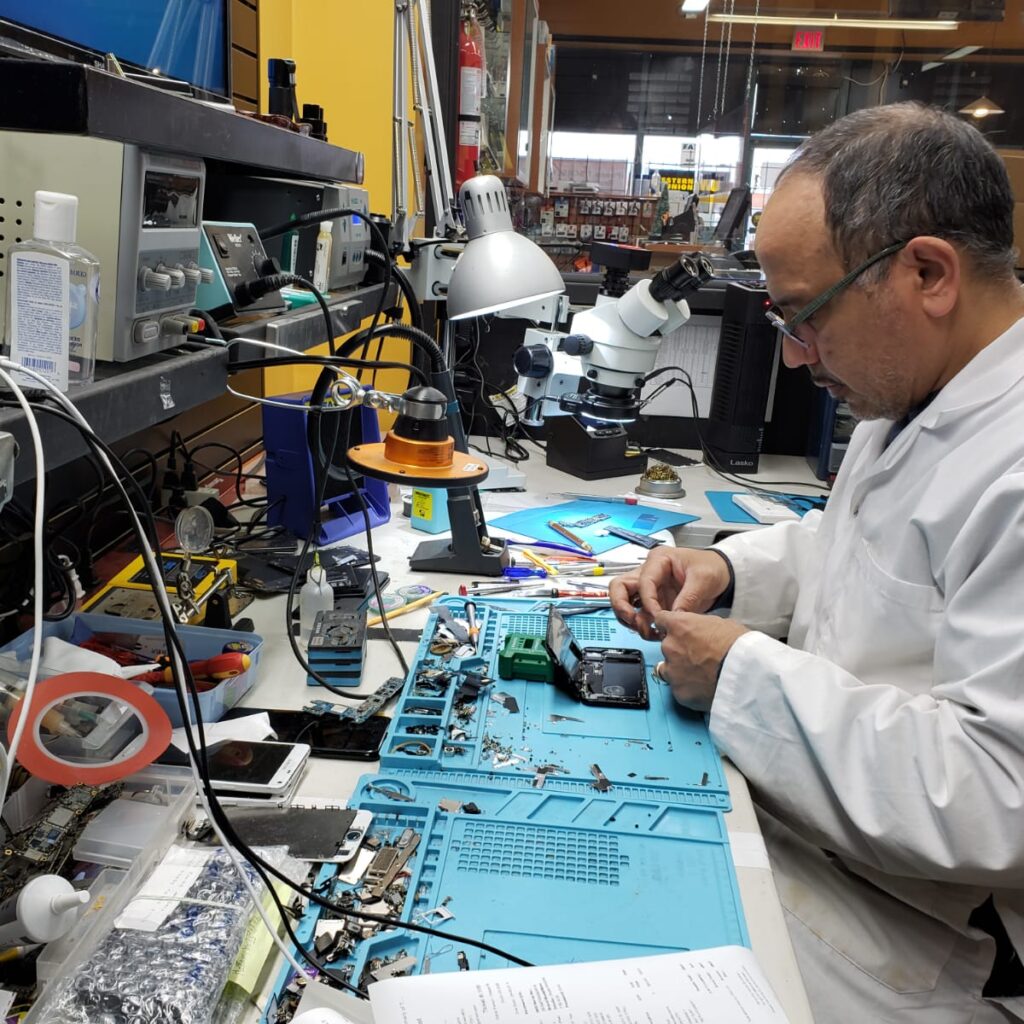 man_repairing_motherboard_in_lab